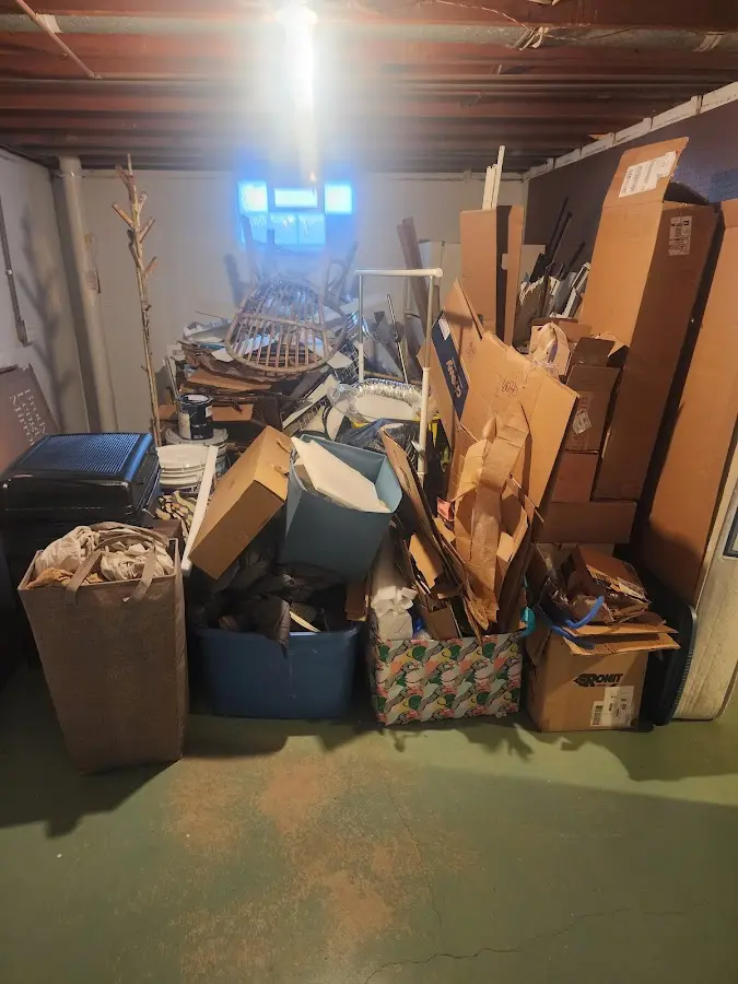 Roll-off dumpster container at job site for 2 Yard Dumpster Rental in Hastings